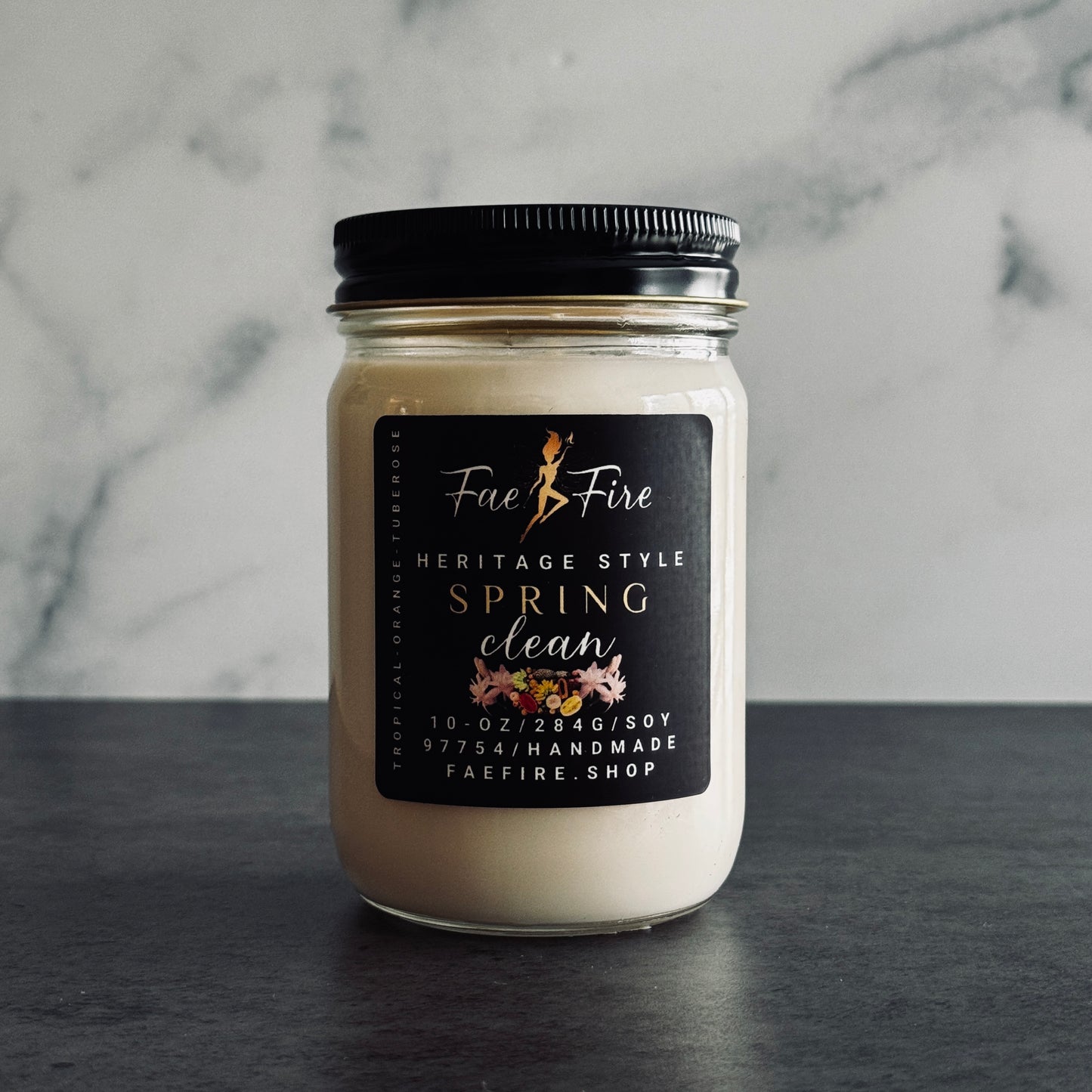 Primary Image: "Heritage Collection Spring Clean soy candle in clear glass jar with black metal lid against dark background"
Lifestyle Image: "Spring Clean luxury candle creating fresh atmosphere in bright, organized space"
Detail Shot: "Close-up of Spring Clean candle highlighting premium wax and elegant black label design"