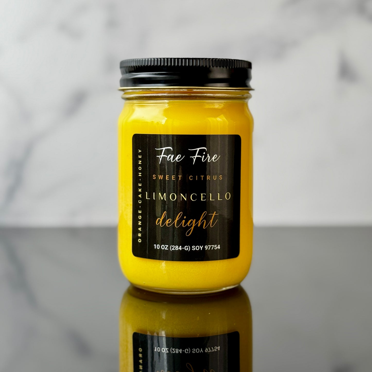 Primary Image: "Heritage Collection Limoncello Delight yellow soy candle in clear glass jar with black lid"
Lifestyle Image: "Limoncello Delight luxury candle brightening kitchen space with Mediterranean charm"
Detail Shot: "Close-up of Limoncello Delight candle highlighting artisanal craftsmanship and label design"